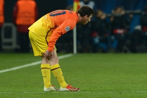 Barcelona's Argentinian forward Lionel Messi holds his leg during the Champions League quarter-final football match between Paris Saint-Germain and Barcelona at the Parc des Princes stadium in Paris on April 2, 2013.     AFP PHOTO / FRANCK FIFEFRANCK FIFE/AFP/Getty Images
