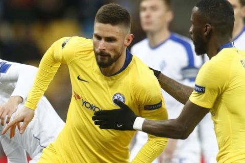 Chelsea's Olivier Giroud celebrates after scoring his side's opening goal during the Europa League round of 16, second leg soccer match between Dynamo Kiev and Chelsea at the Olympiyskiy stadium in Kiev, Ukraine, Thursday, March 14, 2019. (AP Photo/Efrem Lukatsky)