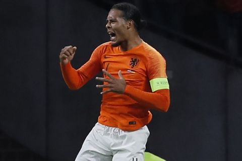 Netherland's Virgil Van Dijk celebrates after scoring the opening goal during the UEFA Nations League soccer match between The Netherlands and Germany at the Johan Cruyff ArenA in Amsterdam, Saturday, Oct. 13, 2018. (AP Photo/Peter Dejong)