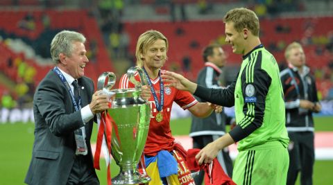 Coach Jupp Heynckes (L) Anatoliy Tymoshchuk (C) and Manuel Neuer of FC Bayern München celebrate with the cup after the UEFA Champions League final against Borussia Dortmund