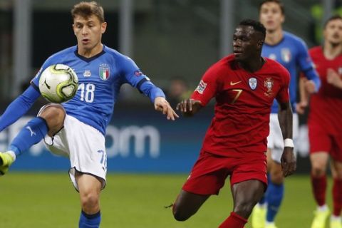 Italy's Nicolo Barella, left, and Portugal's Bruma challenge for the ball during the UEFA Nations League soccer match between Italy and Portugal at the San Siro Stadium, in Milan, Saturday, Nov. 17, 2018. (AP Photo/Antonio Calanni)
