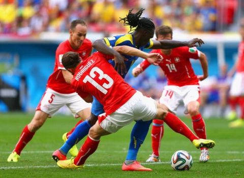 BRASILIA, BRAZIL - JUNE 15:  Ricardo Rodriguez of Switzerland challenges Felipe Caicedo of Ecuador during the 2014 FIFA World Cup Brazil Group E match between Switzerland and Ecuador at Estadio Nacional on June 15, 2014 in Brasilia, Brazil.  (Photo by Clive Brunskill/Getty Images)