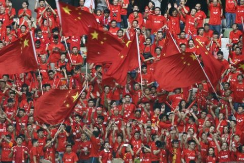 China fans cheer during the 2018 World Cup Asian qualifying match against Hong Kong in Shenzhen, south China's Guangdong province, Thursday, Sept. 3, 2015. (AP Photo/Vincent Yu)
