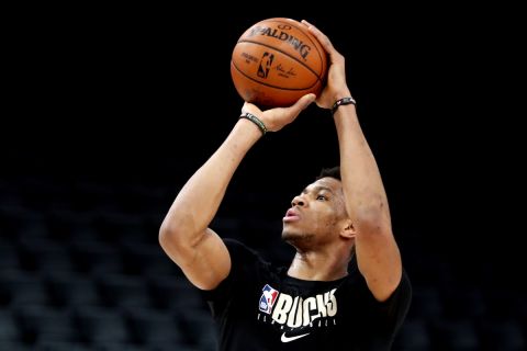 Milwaukee Bucks' Giannis Antetokounmpo shoots during a training session ahead of the NBA basketball game against Charlotte Hornets, in Paris, Thursday, Jan. 23, 2020. (AP Photo/Thibault Camus)