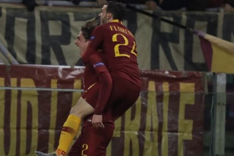Roma midfielder Nicolo' Zaniolo, left, celebrates after scoring the opening goal with his teammate Alessandro Florenzi during a Champions League round of 16 first leg soccer match between Roma and Porto, at Rome's Olympic Stadium, Tuesday, Feb. 12, 2019. (AP Photo/Andrew Medichini)