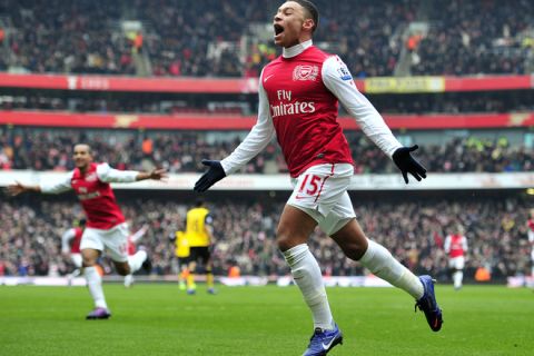 Arsenal's English striker Alex Oxlade-Chamberlain celebrates scoring their third goal during the English Premier League football match between Arsenal and Blackburn Rovers at The Emirates Stadium in north London, England on February 4, 2012. AFP PHOTO/GLYN KIRK

RESTRICTED TO EDITORIAL USE. No use with unauthorized audio, video, data, fixture lists, club/league logos or live services. Online in-match use limited to 45 images, no video emulation. No use in betting, games or single club/league/player publications. (Photo credit should read GLYN KIRK/AFP/Getty Images)