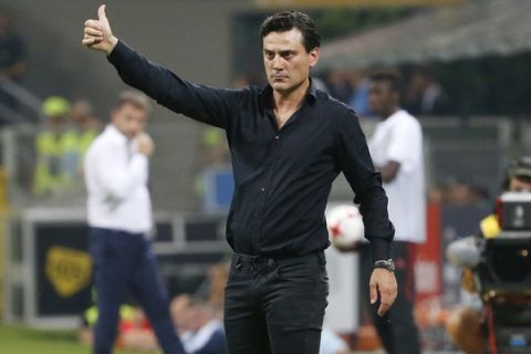 AC Milan coach Vincenzo Montella gives instructions during an Europa League third qualifying round, second leg, soccer match at the San Siro stadium in Milan, Italy, Thursday, Aug. 3, 2017. (AP Photo/Antonio Calanni)