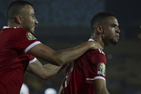 Morocco's Youssef En-Nesyri, right, and Games Saiss celebrate after a goal during the African Cup of Nations group D soccer match between Morocco and Ivory Coast in Al Salam Stadium in Cairo, Egypt, Friday, June 28, 2019. (AP Photo/Hassan Ammar)