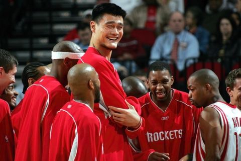 HOUSTON - NOVEMBER 2:  Center Yao Ming #11 and Tracy McGrady #1 of the Houston Rockets share a laugh before a game against the Sacramento Kings on November 2, 2005 at the Toyota Center in Houston, Texas.  NOTE TO USER:  User expressly acknowledges and agrees that, by downloading and or using this Photograph, user is consenting to the terms and conditions of the Getty Images License Agreement.  (Photo by Ronald Martinez/Getty Images)