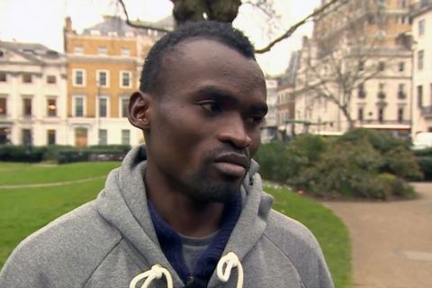FILE - In this file image made available Tuesday, March 10, 2015, from TV, 100-meter sprinter from Sierra Leone Jimmy Thoronka talks to the media in London.  Thoronka decided to stay in Britain after the Commonwealth Games in Glasgow in August 2014, when his passport and money were stolen and then he said his adopted mother died in a suspected Ebola case, so he started living on the streets of London. Thoronka says he is afraid of returning to his Ebola-blighted homeland, and is now hoping to resume his athletics career in Britain. (BBC Pool via AP, File) TV OUT