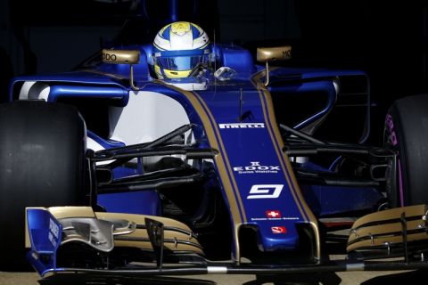 Sauber driver Marcus Ericsson of Sweden leaves the team box during a Formula One pre-season testing session at the Catalunya racetrack in Montmelo, outside Barcelona, Spain, Friday, March 10, 2017. (AP Photo/Francisco Seco)