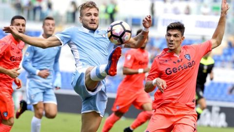 Lazio's Ciro Immobile, left, and Empoli's Federico Barba fight for the ball during a Serie A soccer match between Lazio and Empoli, at Rome's Olympic Stadium, Sunday, Sept. 25, 2016. (AP Photo/Andrew Medichini)
