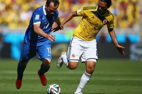 BELO HORIZONTE, BRAZIL - JUNE 14:  Theofanis Gekas of Greece is challenged by Abel Aguilar of Colombia during the 2014 FIFA World Cup Brazil Group C match between Colombia and Greece at Estadio Mineirao on June 14, 2014 in Belo Horizonte, Brazil.  (Photo by Paul Gilham/Getty Images)