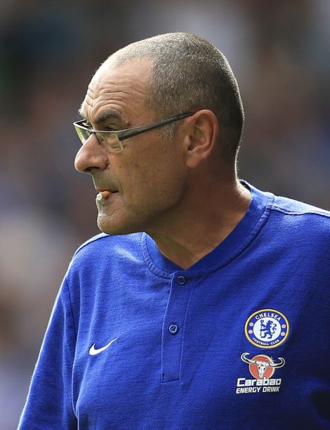 Chelsea manager Maurizio Sarri looks out from the sidelines during the Premier League match against Huddersfield, at the John Smith's Stadium in Huddersfield, England, Saturday Aug. 11, 2018. (Mike Egerton/PA via AP)