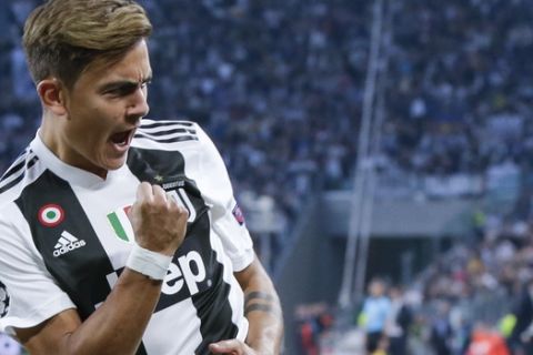 Juventus' Paulo Dybala celebrates after scoring his side's opening goal during the Champions League, group H soccer match between Juventus and Young Boys, at the Allianz stadium in Turin, Italy, Tuesday, Oct. 2, 2018. (AP Photo/Luca Bruno)