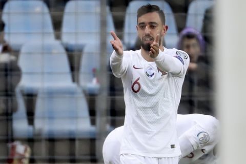 Portugal's Bruno Fernandes celebrates after he scored his side's first goal during the Euro 2020 group B qualifying soccer match between Luxembourg and Portugal at the Josy Barthel stadium in Luxembourg, Sunday, Nov. 17, 2019. (AP Photo/Francisco Seco)