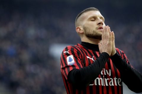 AC Milan's Ante Rebic reacts after missing a scoring chance during a Serie A soccer match between AC Milan and Hellas Verona, at the San Siro stadium in Milan, Italy, Sunday, Feb. 2, 2020. Match ends 1-1-. (AP Photo/Luca Bruno)