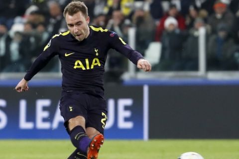 Tottenham's Christian Eriksen scores on a free-kick during the Champions League, round of 16, first-leg soccer match between Juventus and Tottenham Hotspurs, at the Allianz Stadium in Turin, Italy, Tuesday, Feb. 13, 2018. (AP Photo/Antonio Calanni)