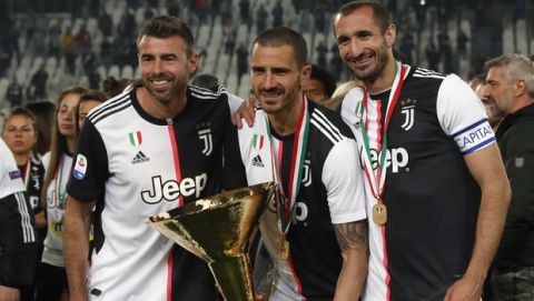 Juventus' Andrea Barzagli, Juventus' Leonardo Bonucci, and Juventus' Giorgio Chiellini, from left to right, pose after winning the Serie A soccer title trophy, at the Allianz Stadium, in Turin, Italy, Sunday, May 19, 2019. (AP Photo/Antonio Calanni)