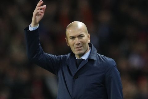 Real Madrid head coach Zinedine Zidane gestures during the Champions League round of sixteen second leg soccer match between Paris St. Germain and Real Madrid at the Parc des Princes stadium in Paris, France, Tuesday, March 6, 2018. (AP Photo/Christophe Ena)