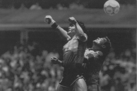 ** FILE ** Argentina's Diego Maradona, left, beats England goalkeeper Peter Shilton to a high ball and score his first of two goals in a World Cup quarterfinal in Mexico City, in this June 22, 1986 photo. Argentina won 2-1. Maradona acknowledged that he struck the ball with his hand in the famous "Hand of God" goal against England in the 1986 World Cup quarterfinals.  Speaking on his local television talk show Monday night, Aug. 22, 2005, Maradona called one of soccer's most controversial goals "something that just came out of me. It was a bit of mischief." (AP Photo/El Grafico, Buenos Aires)