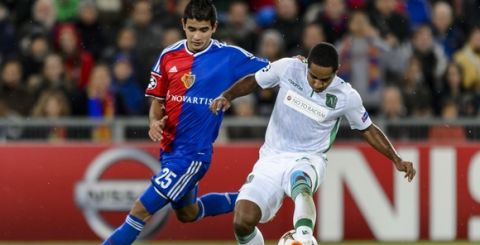 FC Basel's forward Derlis Gonzalez (L) vies for the ball with Ludogorets Razgrad's defender from Colombia Brayan Angulo during to the UEFA Champions League Group B football match between FC Basel and Ludogorets Razgrad on November 4, 2014 at the St. Jakob-Park stadium in Basel. AFP PHOTO / FABRICE COFFRINI        (Photo credit should read FABRICE COFFRINI/AFP/Getty Images)