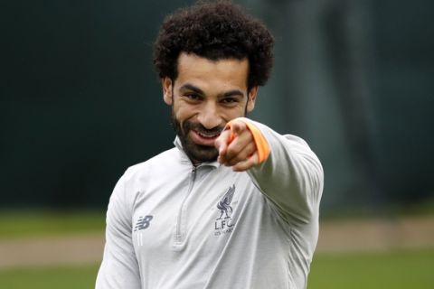 Liverpool's Mohamed Salah smiles during a training session at Melwood Training Ground, Liverpool, Britain, Monday, April 23, 2018, on the eve of their Champions League semifinal with AS Roma. (Martin Rickett/PA via AP)