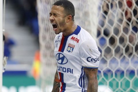 Lyon's Memphis Depay reacts after missing a goal during their French League One soccer match against Dijon in Decines, near Lyon, central France, Sunday, Feb. 19, 2017. (AP Photo/Laurent Cipriani)