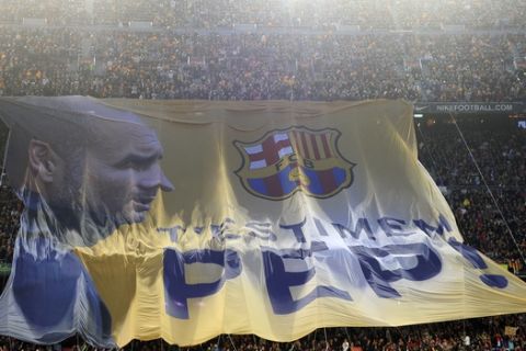 A giant picture of FC Barcelon's coach Pep Guardiola is seen prior to the match between FC Barcelona and Espanyol during a Spanish La Liga soccer match at the Camp Nou stadium in Barcelona, Spain, Saturday, May 5, 2012. FC Barcelona's coach Pep Guardiola will not continue as coach of the Spanish club after this season and assistant Tito Vilanova will take over. The picture reads in catalan "We love you Pep". (AP Photo/Manu Fernandez)