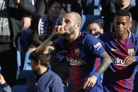Barcelona's Aleix Vidal celebrates after scoring his team's 3rd goal during a Spanish La Liga soccer match between Real Madrid and Barcelona at the Santiago Bernabeu stadium in Madrid, Spain, Saturday, Dec. 23, 2017. (AP Photo/Paul White)