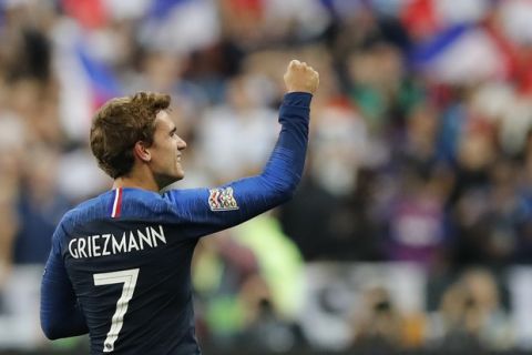 France's Antoine Griezmann celebrates scoring his side's 2nd goal during a UEFA Nations League soccer match between France and Germany at Stade de France stadium in Saint Denis, north of Paris, Tuesday, Oct. 16, 2018. (AP Photo/Christophe Ena)