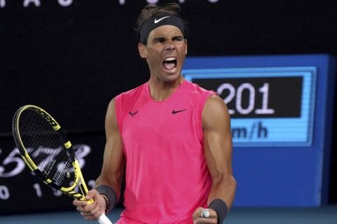 Spain's Rafael Nadal celebrates after winning the third set against Australia's Nick Kyrgios during their fourth round singles match at the Australian Open tennis championship in Melbourne, Australia, Monday, Jan. 27, 2020. (AP Photo/Lee Jin-man)