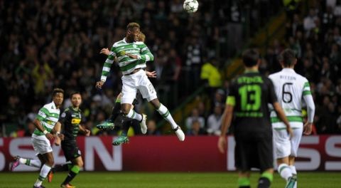 Celtic's French striker Moussa Dembele (C) jumps to head the ball during the UEFA Champions League Group C football match between Celtic and Borussia Monchengladbach at Celtic Park stadium in Glasgow, Scotland on October 19, 2016. / AFP / Andy Buchanan        (Photo credit should read ANDY BUCHANAN/AFP/Getty Images)