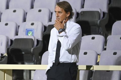 Italy coach Roberto Mancini waits for the start of the UEFA Nations League soccer match between Italy and Bosnia Herzegovina, at the Artemio Franchi Stadium in Florence, Italy, Friday, Sept. 4, 2020. (Massimo Paolone/LaPresse via AP)