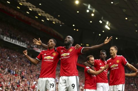 Manchester United's Romelu Lukaku, second left, celebrates scoring his side's first goal of the game during the English Premier League soccer match between Manchester United and West Ham United at Old Trafford in Manchester, England, Sunday, Aug. 13, 2017. (AP Photo/Dave Thompson)