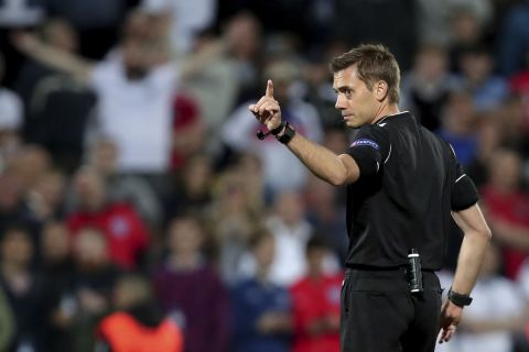 FILE - Referee Clement Turpin gives instructions during the UEFA Nations League semifinal soccer match between Netherlands and England at the D. Afonso Henriques stadium in Guimaraes, Portugal, Thursday, June 6, 2019. Turpin will referee the Champions League final between Liverpool and Real Madrid on Saturday May 28. (AP Photo/Luis Vieira, File)