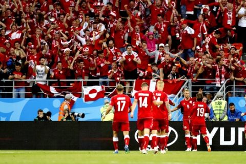 Denmark soccer team's fans celebrates after scoring the opening goal against Peru team during the group C match between Peru and Denmark at the 2018 soccer World Cup in the Mordovia Arena in Saransk, Russia, Saturday, June 16, 2018. (AP Photo/Efrem Lukatsky)