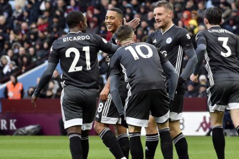 Leicester's Jamie Vardy celebrates with teammates after scoring his side's opening goal during the English Premier League soccer match between Aston Villa and Leicester City at Villa Park in Birmingham, England, Sunday, Dec. 8, 2019. (AP Photo/Rui Vieira)