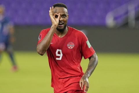 Canada forward Cyle Larin (9) gestures after scoring his third goal against Bermuda during the second half of a World Cup 2022 Group B qualifying soccer match, Thursday, March 25, 2021, in Orlando, Fla. (AP Photo/John Raoux)