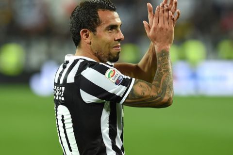TURIN, ITALY - MAY 05:  Carlos Tevez of Juventus celebrates after beating Atalanta BC 1-0 to win the Serie A Championships at the end of the Serie A match between Juventus and Atalanta BC at Juventus Arena on May 5, 2014 in Turin, Italy.  (Photo by Valerio Pennicino/Getty Images)