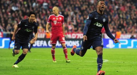 MUNICH, GERMANY - APRIL 09:  Patrice Evra (R) of Manchester United celebrates his goal during the UEFA Champions League Quarter Final second leg match between FC Bayern Muenchen and Manchester United at Allianz Arena on April 9, 2014 in Munich, Germany.  (Photo by Shaun Botterill/Getty Images)