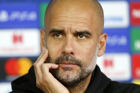 Manchester City's coach Pep Guardiola attends a press conference ahead of the Group C Champions League soccer match between Manchester City and FC Shakhtar Donetsk in Kharkiv, Ukraine, Tuesday, Sept. 17, 2019. (AP Photo/Efrem Lukatsky)