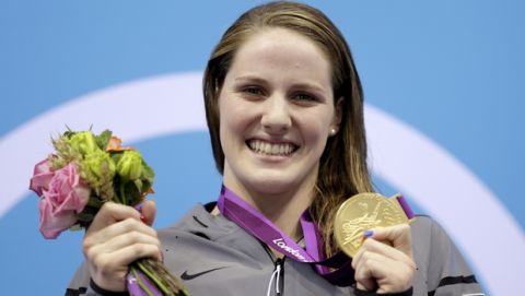 United States' Missy Franklin holds her gold medal in the women's 200-meter backstroke final at the Aquatics Centre in the Olympic Park during the 2012 Summer Olympics in London, Friday, Aug. 3, 2012. (AP Photo/Michael Sohn)