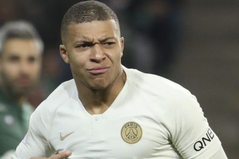 PSG forward Kylian Mbappe celebrates after scoring the opening goal during the French League One soccer match between Saint-Etienne and Paris Saint-Germain, at the Geoffroy Guichard stadium, in Saint-Etienne, central France, Sunday, Feb. 17, 2019. (AP Photo/Laurent Cipriani)