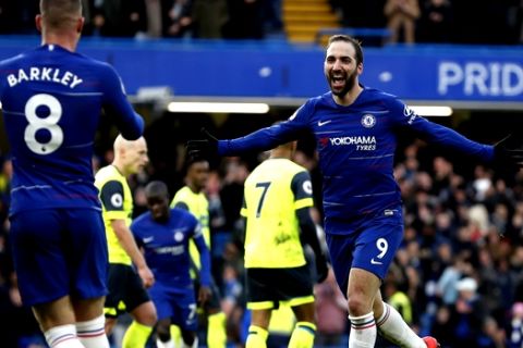 Chelsea's Gonzalo Higuain celebrates after scoring his side's fourth goal during the English Premier League soccer match between Chelsea and Huddersfield Town at Stamford Bridge stadium in London, Britain, Saturday, Feb. 2, 2019. (AP Photo/ Alastair Grant)