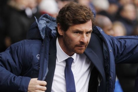 FILE - This is a Sunday, Dec. 1, 2013 file photo of Tottenham Hotspur's manager Andre Villas-Boas as he looks on from the dugout before the start of their English Premier League soccer match against Manchester United at White Hart Lane, London  Tottenham manager Andre Villas-Boas has been fired by the Premier League club on Monday Dec. 16, 2013 a day after a 5-0 loss to Liverpool left the Portuguese coach under pressure. (AP Photo/Sang Tan, File)