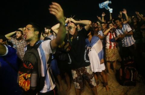 RIO DE JANEIRO, BRAZIL - JULY 09:  Argentina fans gather on Copacabana Beach during their match against the Netherlands in the 2014 FIFA World Cup on July 9, 2014 in Rio de Janeiro, Brazil. Argentina went on to win in a shootout and advances to the final match at Maracana.  (Photo by Mario Tama/Getty Images)