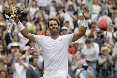 Spain's Rafael Nadal celebrates after beating Jo-Wilfried Tsonga of France in a Men's singles match during day six of the Wimbledon Tennis Championships in London, Saturday, July 6, 2019. (AP Photo/Tim Ireland)