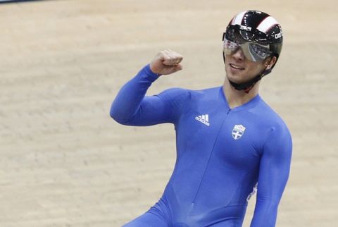 Greece's Christos Volikakis celebrates after winning the bronze in the men's track cycling sprint event during the European Track Cycling Championships in Panevezys, Lithuania, Saturday, Oct. 20, 20120. (AP Photo/Mindaugas Kulbis)  