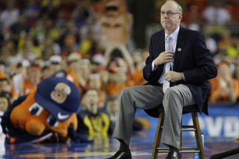 Syracuse head coach Jim Boeheim watches play against Michigan during the second half of the NCAA Final Four tournament college basketball semifinal game Saturday, April 6, 2013, in Atlanta. (AP Photo/Charlie Neibergall)  ORG XMIT: FF279